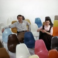 Eameses sitting on fiberglass chairs