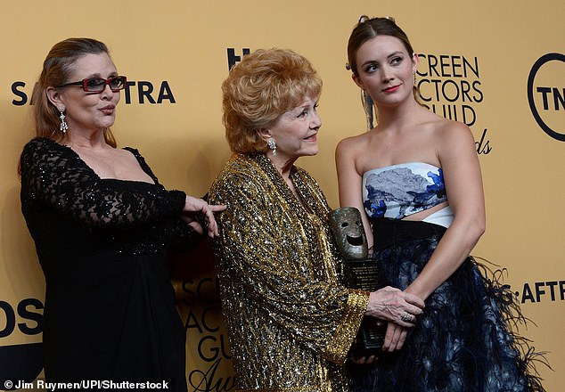 Fisher's mother and Billie's grandmother, Singin' in the Rain star Debbie Reynolds, died at age 84 after a stroke on December 28, 2016, while planning Fisher's memorial. Photographed in January 2015 in Los Angeles