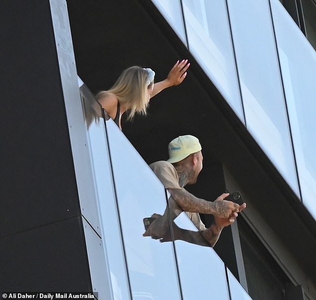 Jamie, with her blonde hair tied under a chic bandana, was beaming as she pointed in the Queen's direction, while Dave, wearing a backwards cap and showing off his tattooed arms, filmed the moment on his phone.